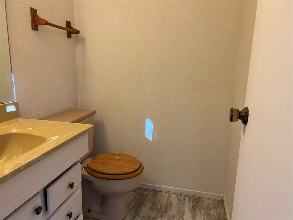 3711 Greenwood Road Weatherford, TX 76088 - Photo 13 of 15 a bathroom with a sink and a toilet