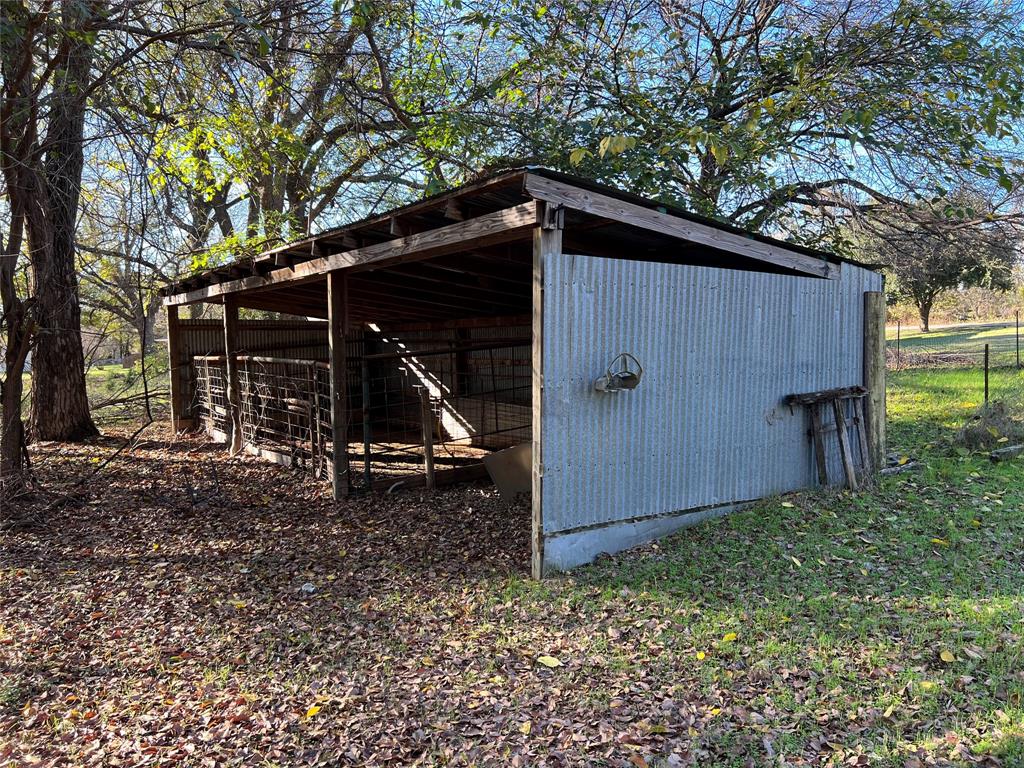 3711 Greenwood Road Weatherford, TX 76088 - Photo 5 of 15 a view of a barn in the middle of a yard