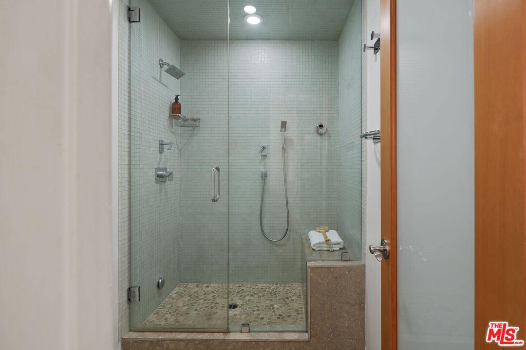 3412 Ocean Front Walk, Unit 201 Marina del Rey, CA 90292 - Photo 12 of 23 a bathroom with a glass shower door