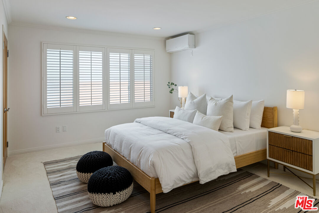 3412 Ocean Front Walk, Unit 201 Marina del Rey, CA 90292 - Photo 15 of 23 a bedroom with a bed and a large window