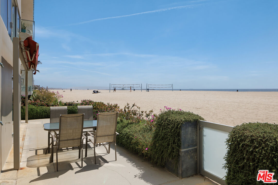 3412 Ocean Front Walk, Unit 201 Marina del Rey, CA 90292 - Photo 19 of 23 a terrace with outdoor seating and lake view
