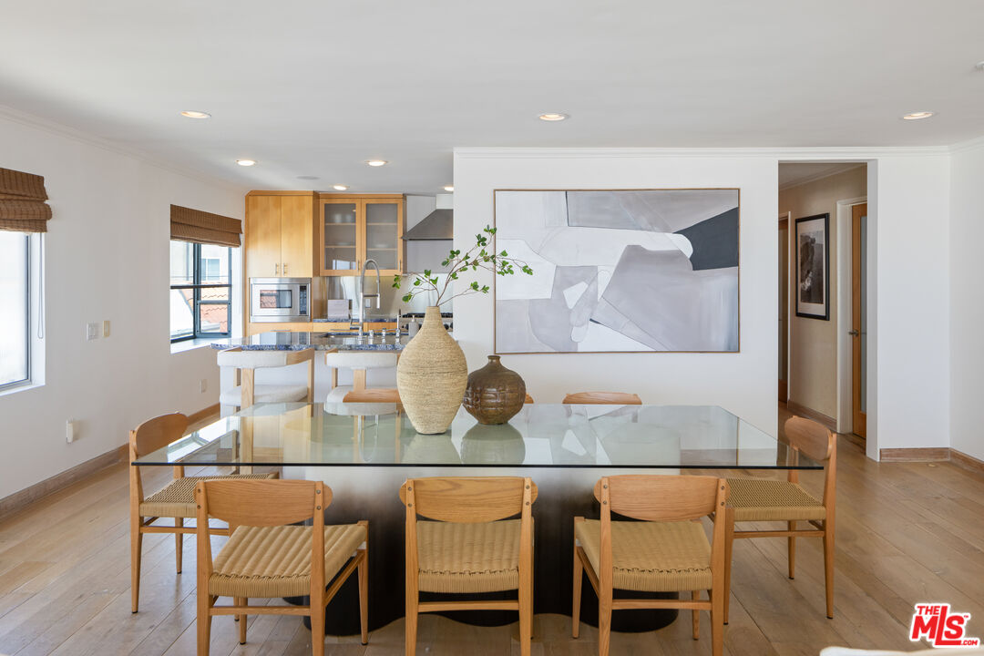 3412 Ocean Front Walk, Unit 201 Marina del Rey, CA 90292 - Photo 5 of 23 a dining room with furniture and wooden floor