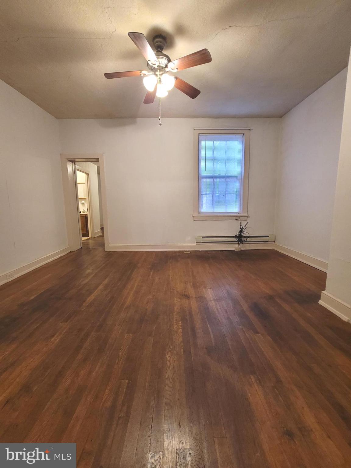 37 East Main Street, Unit 2 Waynesboro, PA 17268 - Photo 17 of 25 wooden floor in an empty room with a window