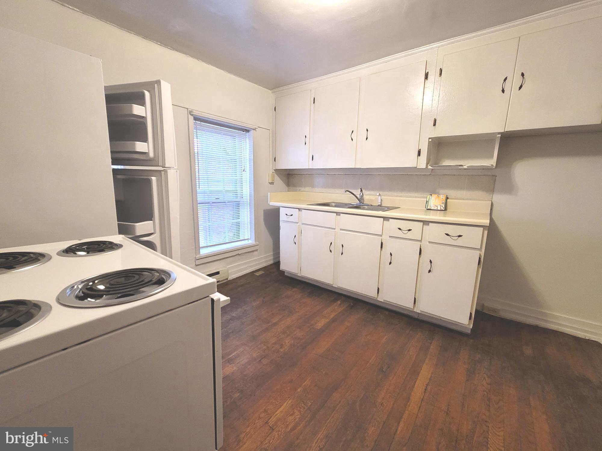 37 East Main Street, Unit 2 Waynesboro, PA 17268 - Photo 20 of 25 a kitchen with granite countertop a sink stove and refrigerator
