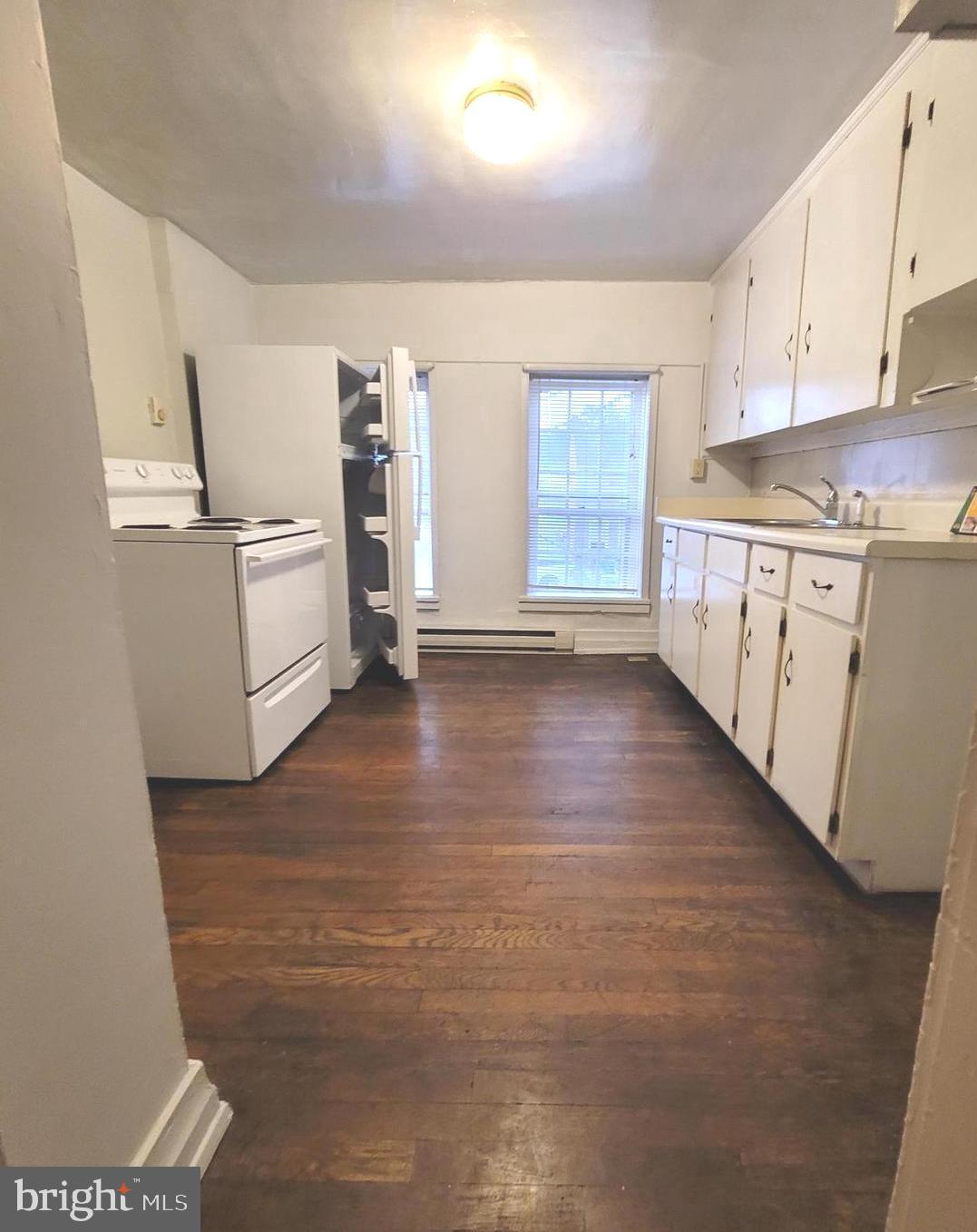 37 East Main Street, Unit 2 Waynesboro, PA 17268 - Photo 8 of 25 a kitchen with white cabinets and white appliances