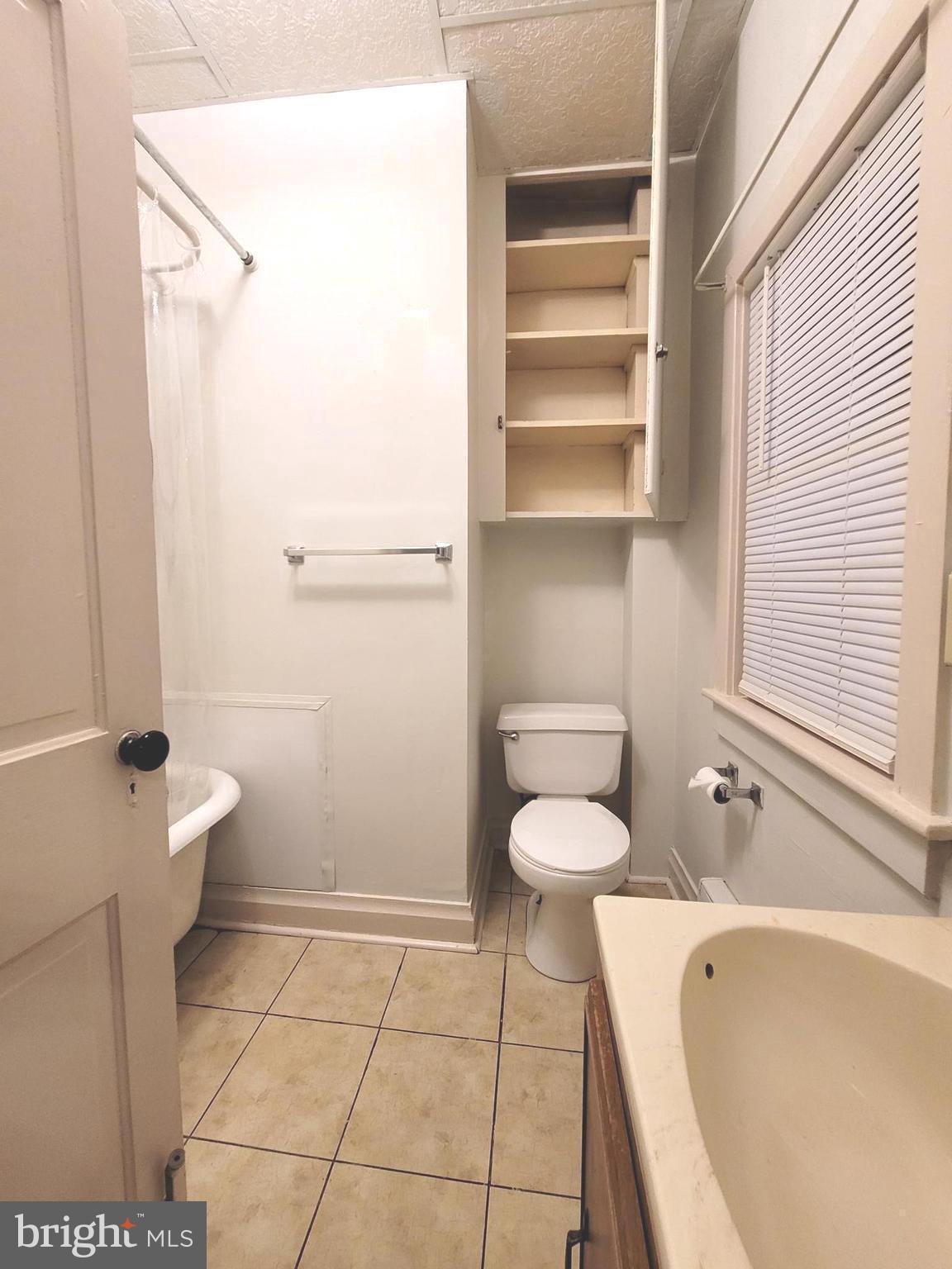 37 East Main Street, Unit 2 Waynesboro, PA 17268 - Photo 9 of 25 a bathroom with a bathtub and toilet