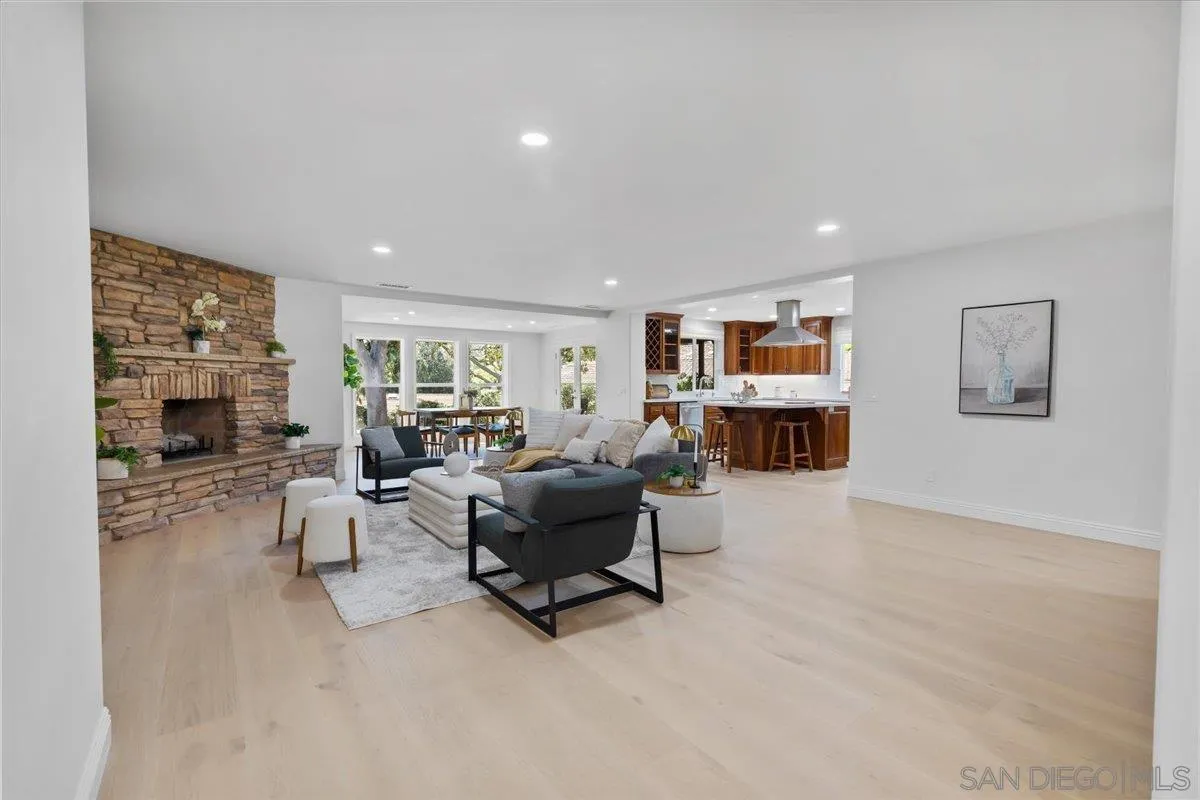 16902 Via De Santa Fe, Unit 12 Rancho Santa Fe, CA 92091 - Photo 13 of 54 a living room with furniture and a fireplace