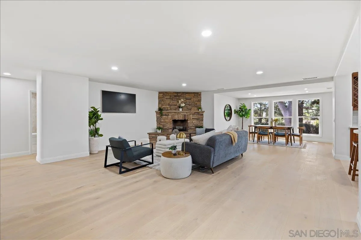 16902 Via De Santa Fe, Unit 12 Rancho Santa Fe, CA 92091 - Photo 15 of 54 a living room with furniture and white walls