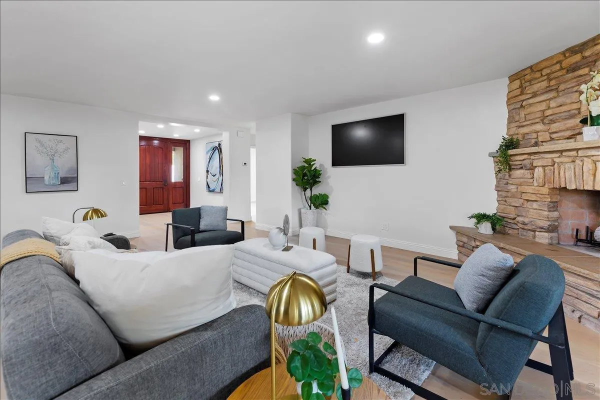 16902 Via De Santa Fe, Unit 12 Rancho Santa Fe, CA 92091 - Photo 16 of 54 a living room with furniture and a flat screen tv