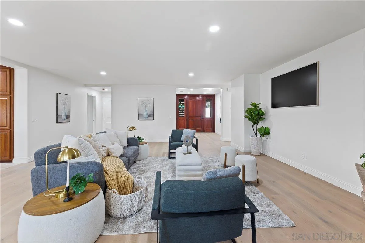 16902 Via De Santa Fe, Unit 12 Rancho Santa Fe, CA 92091 - Photo 19 of 54 a living room with furniture and a flat screen tv