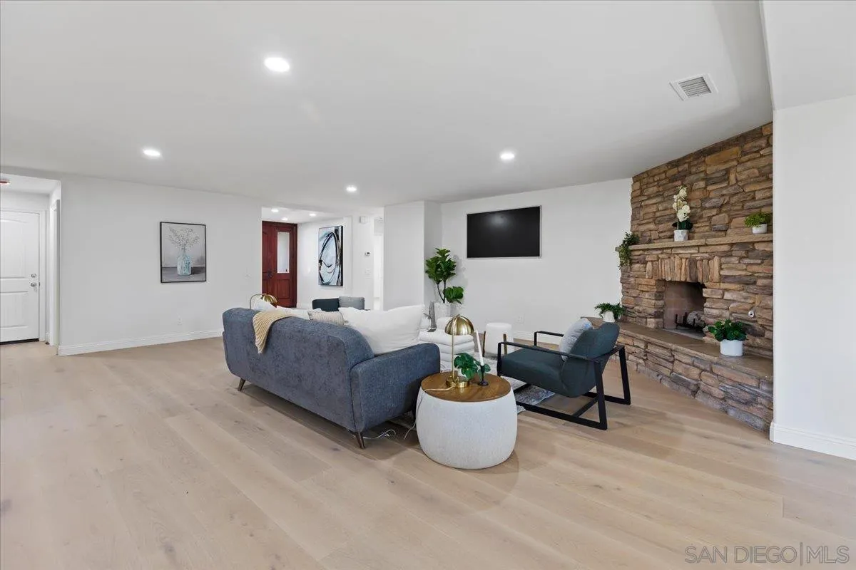 16902 Via De Santa Fe, Unit 12 Rancho Santa Fe, CA 92091 - Photo 23 of 54 a living room with furniture and a flat screen tv