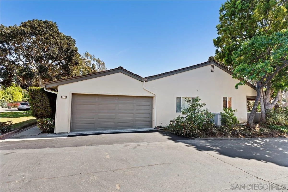 16902 Via De Santa Fe, Unit 12 Rancho Santa Fe, CA 92091 - Photo 3 of 54 front view of a house with a street