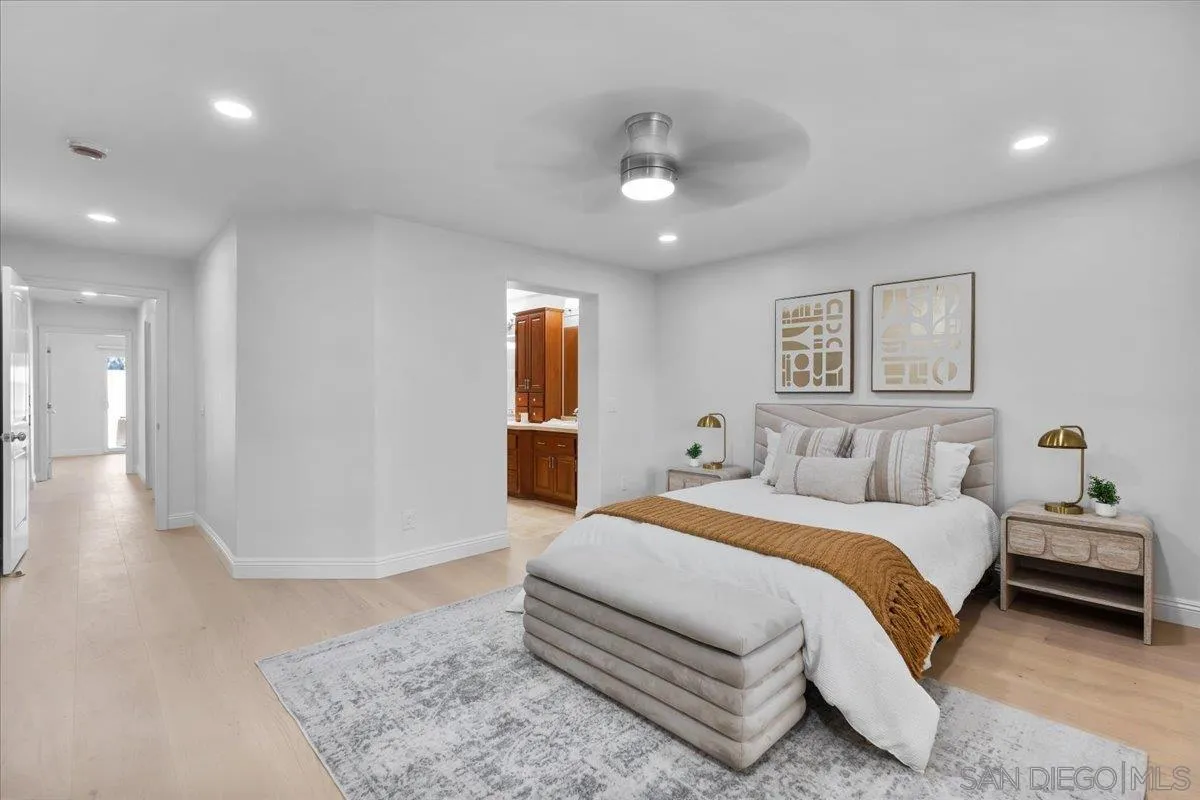 16902 Via De Santa Fe, Unit 12 Rancho Santa Fe, CA 92091 - Photo 32 of 54 a spacious bedroom with a bed and a walk in closet