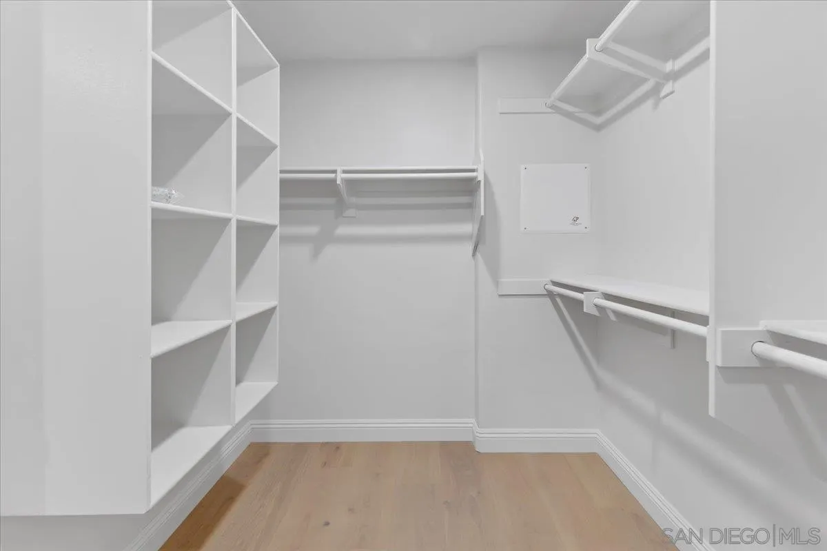 16902 Via De Santa Fe, Unit 12 Rancho Santa Fe, CA 92091 - Photo 34 of 54 a view of walk in closet with empty racks