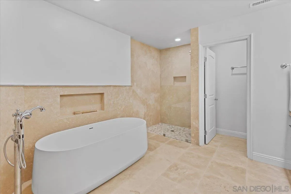 16902 Via De Santa Fe, Unit 12 Rancho Santa Fe, CA 92091 - Photo 37 of 54 a bathroom with a bathtub and shower