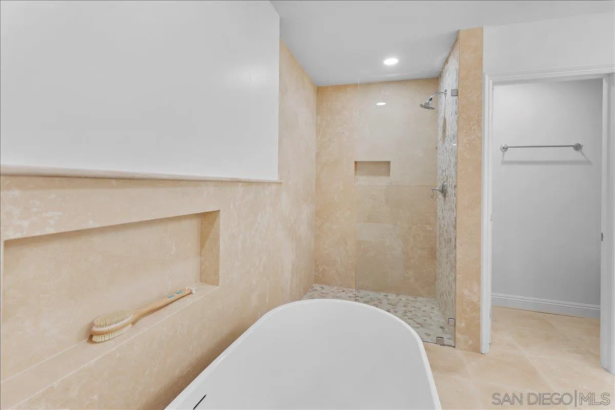 16902 Via De Santa Fe, Unit 12 Rancho Santa Fe, CA 92091 - Photo 39 of 54 a bathroom with a tub and shower