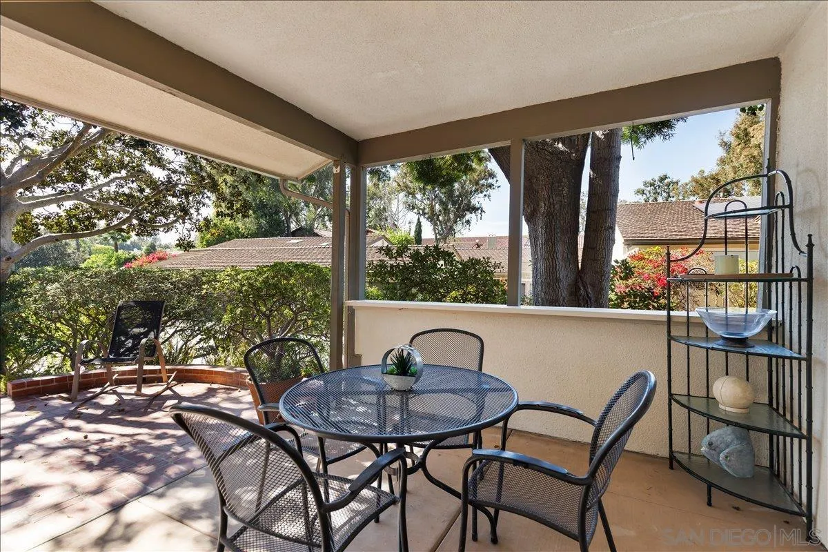 16902 Via De Santa Fe, Unit 12 Rancho Santa Fe, CA 92091 - Photo 43 of 54 a view of a chairs and table in patio