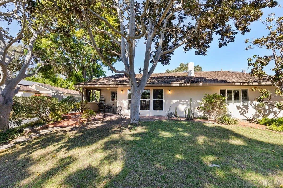 16902 Via De Santa Fe, Unit 12 Rancho Santa Fe, CA 92091 - Photo 47 of 54 a front view of a house with a garden