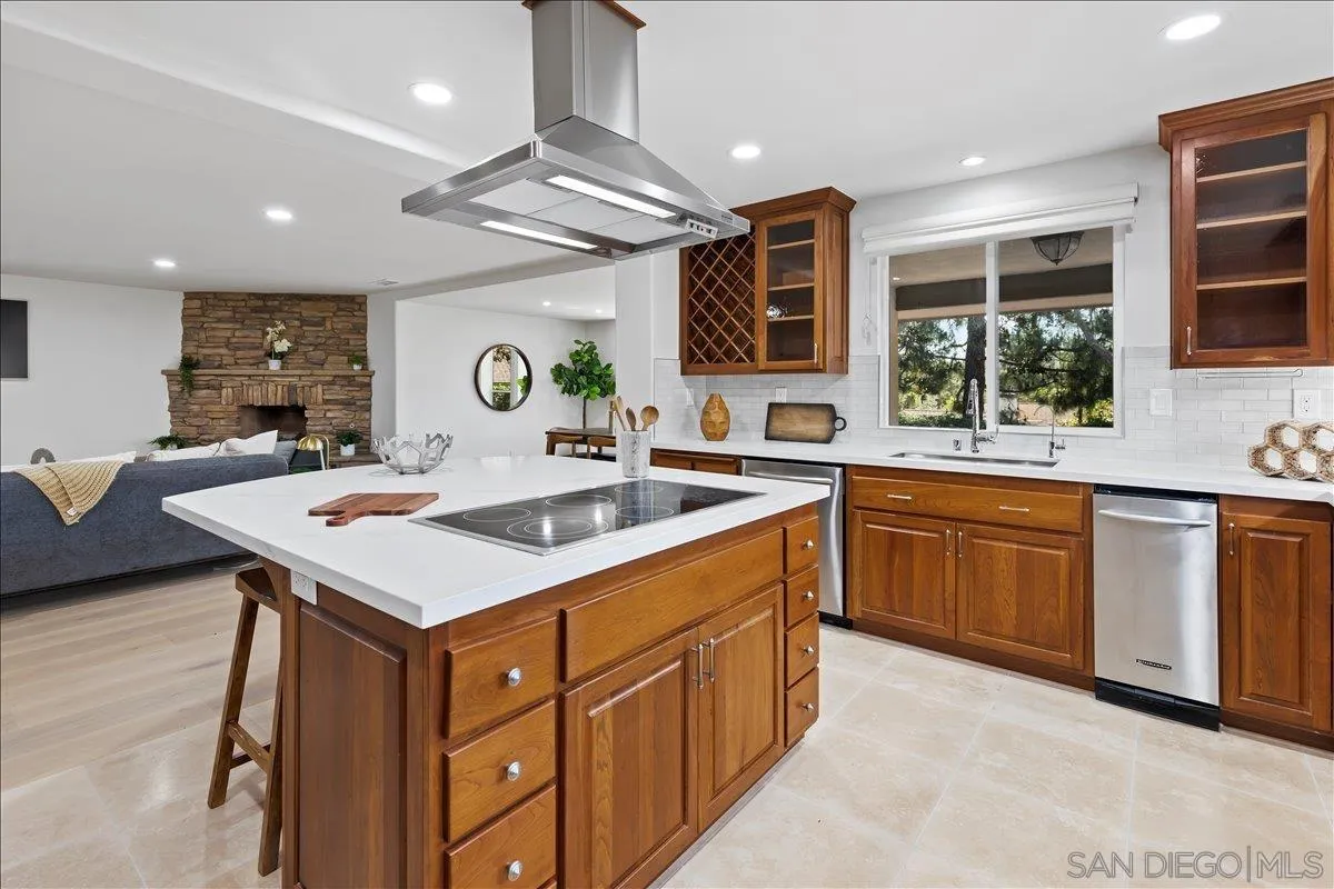16902 Via De Santa Fe, Unit 12 Rancho Santa Fe, CA 92091 - Photo 7 of 54 a kitchen with a sink stove and cabinets