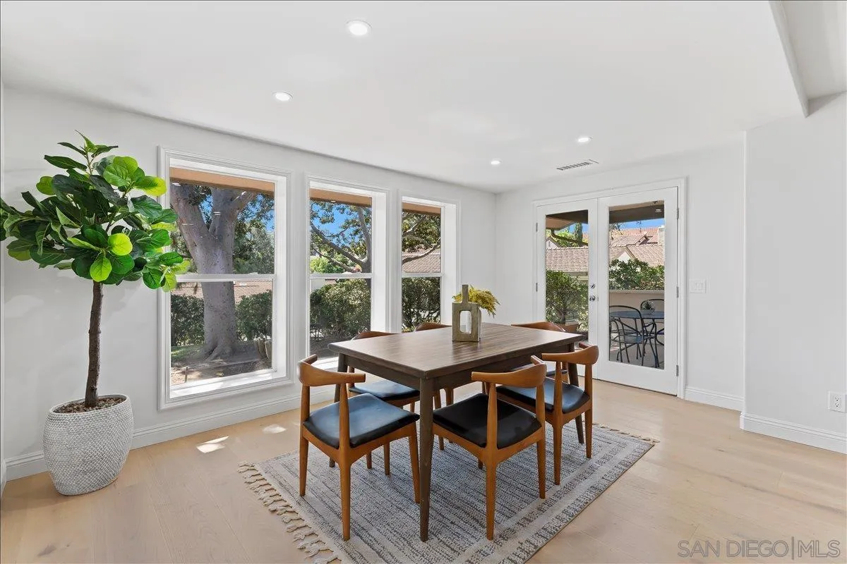 16902 Via De Santa Fe, Unit 12 Rancho Santa Fe, CA 92091 - Photo 8 of 54 a view of a dining room with furniture window and wooden floor