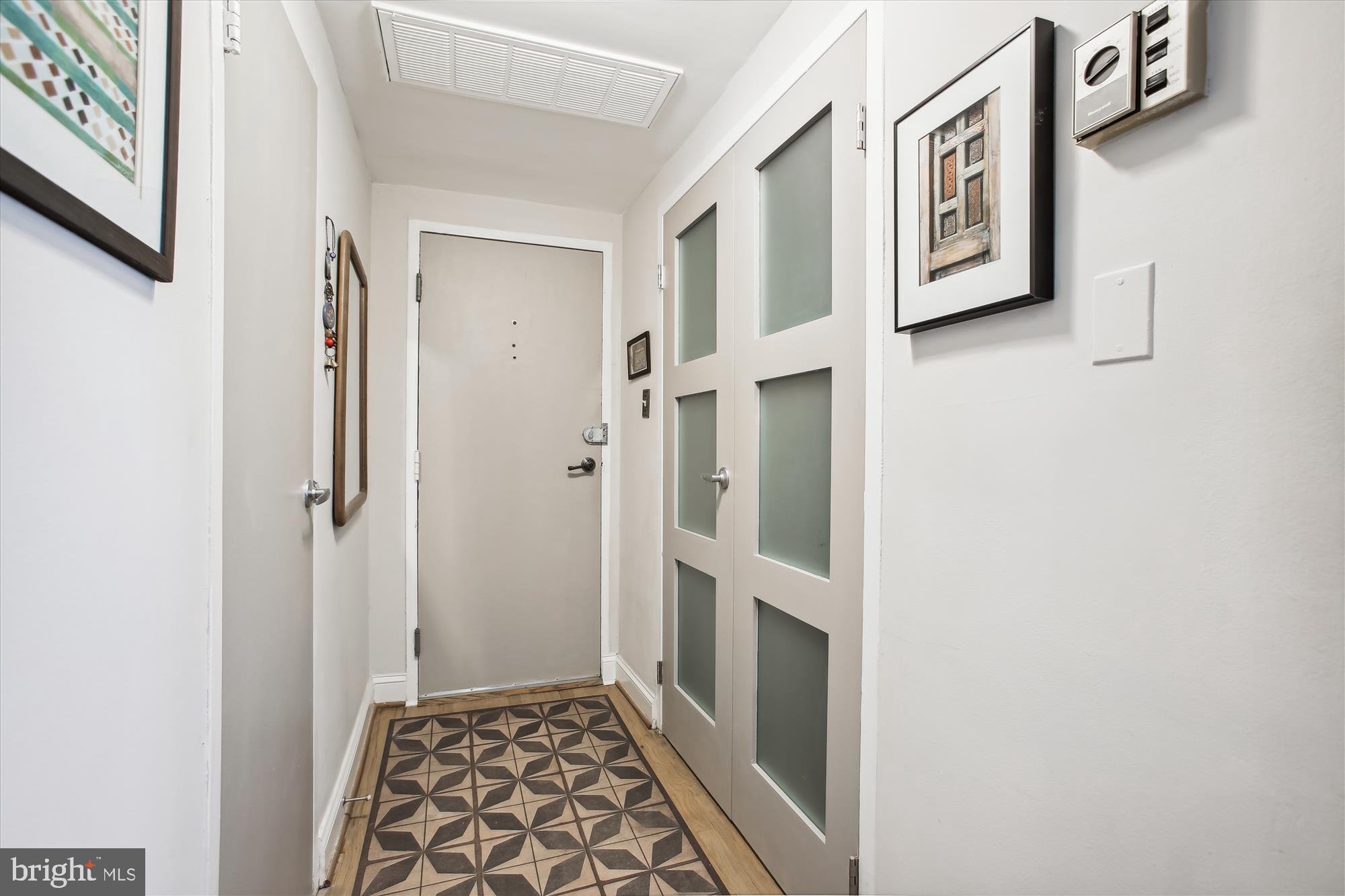 1669 Columbia Road Northwest, Unit 210 Washington, DC 20009 - Photo 7 of 33 Entry Foyer w closet on right and half bath on lef