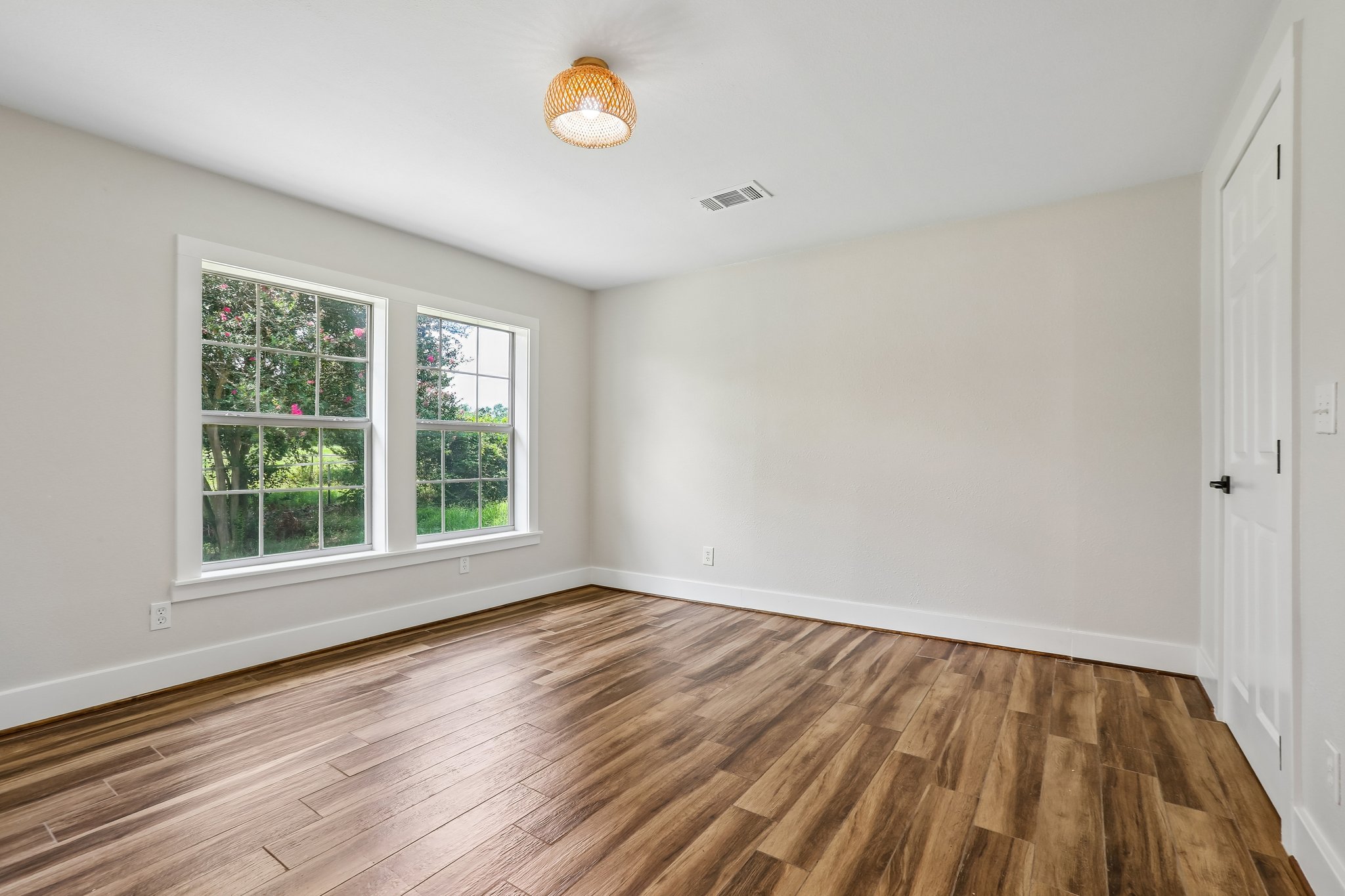 2089 Farm To Market Road 1704 Elgin, TX 78621 - Photo 19 of 31 Rich wood flooring complements neutral walls and ample natural light in this inviting space.
