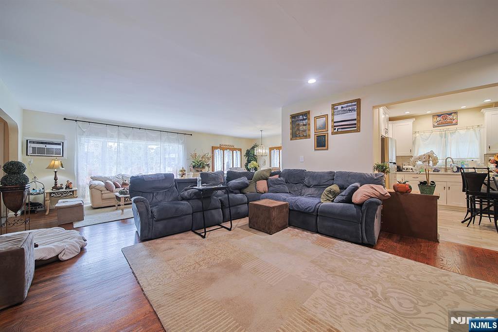 1003 Cumbermeade Road Fort Lee, NJ 07024 - Photo 7 of 23 a living room with furniture or couch and a wooden floor