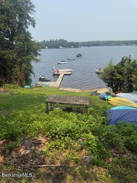 58 Stanley Road Otis, MA 01253 - Photo 4 of 10 a view of a swimming pool with an outdoor space and seating area