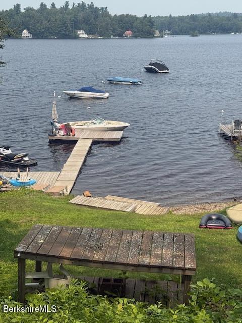 58 Stanley Road Otis, MA 01253 - Photo 5 of 10 a view of a lake with a yard and outdoor seating