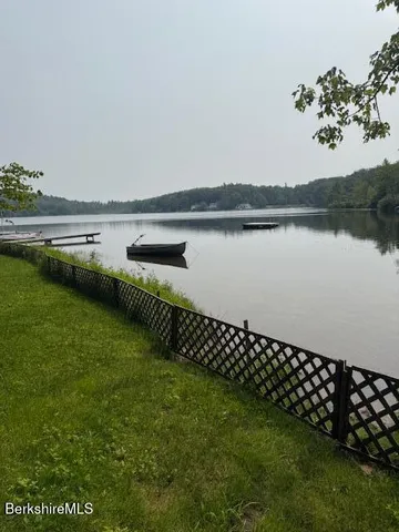 a view of a lake with a yard