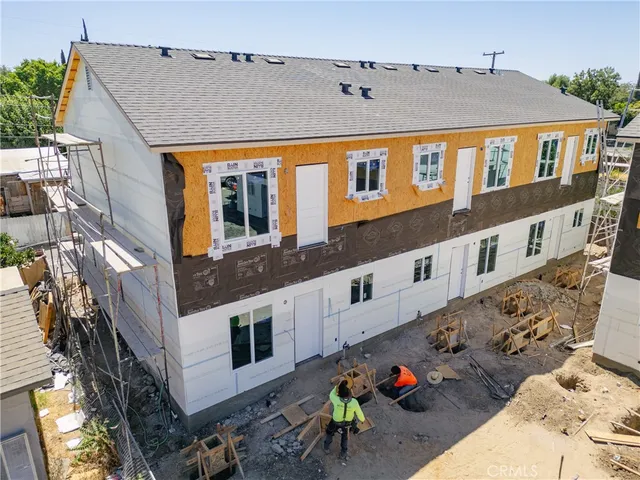 a front view of a building with many windows