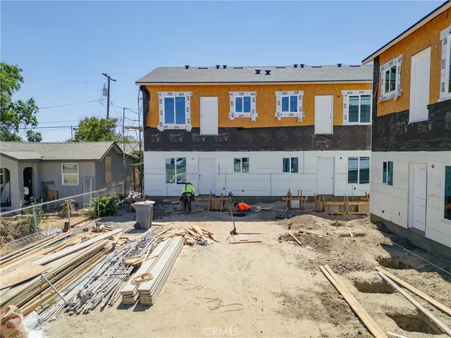 a view of a house with snow on the road