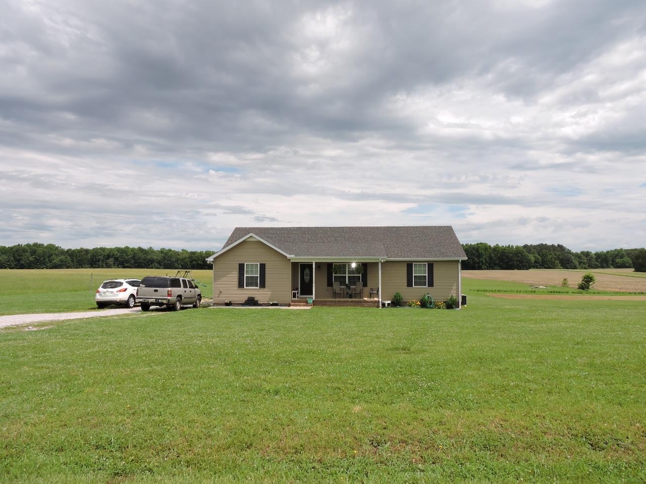 259 Bell Road Morrison, TN 37357 - Photo 2 of 27 a view of a house with a big yard and large trees