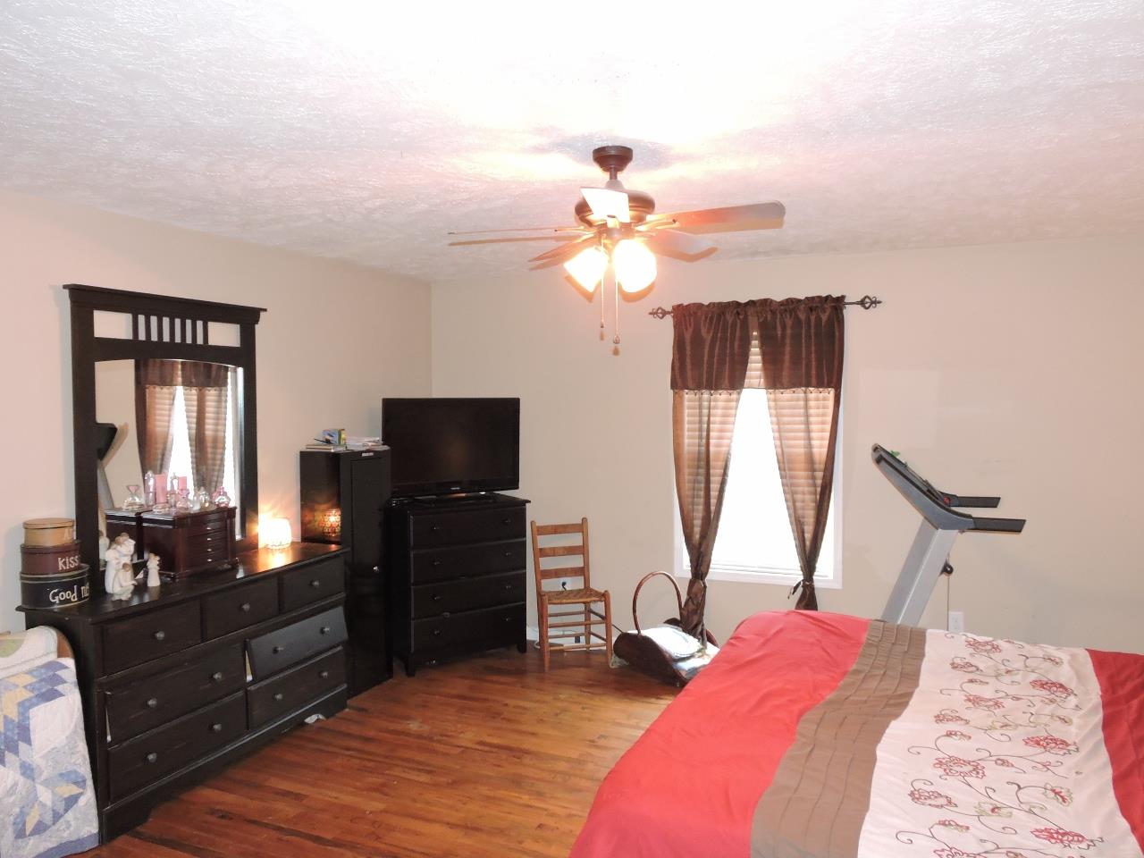 259 Bell Road Morrison, TN 37357 - Photo 13 of 27 a bedroom with a bed and a flat screen tv