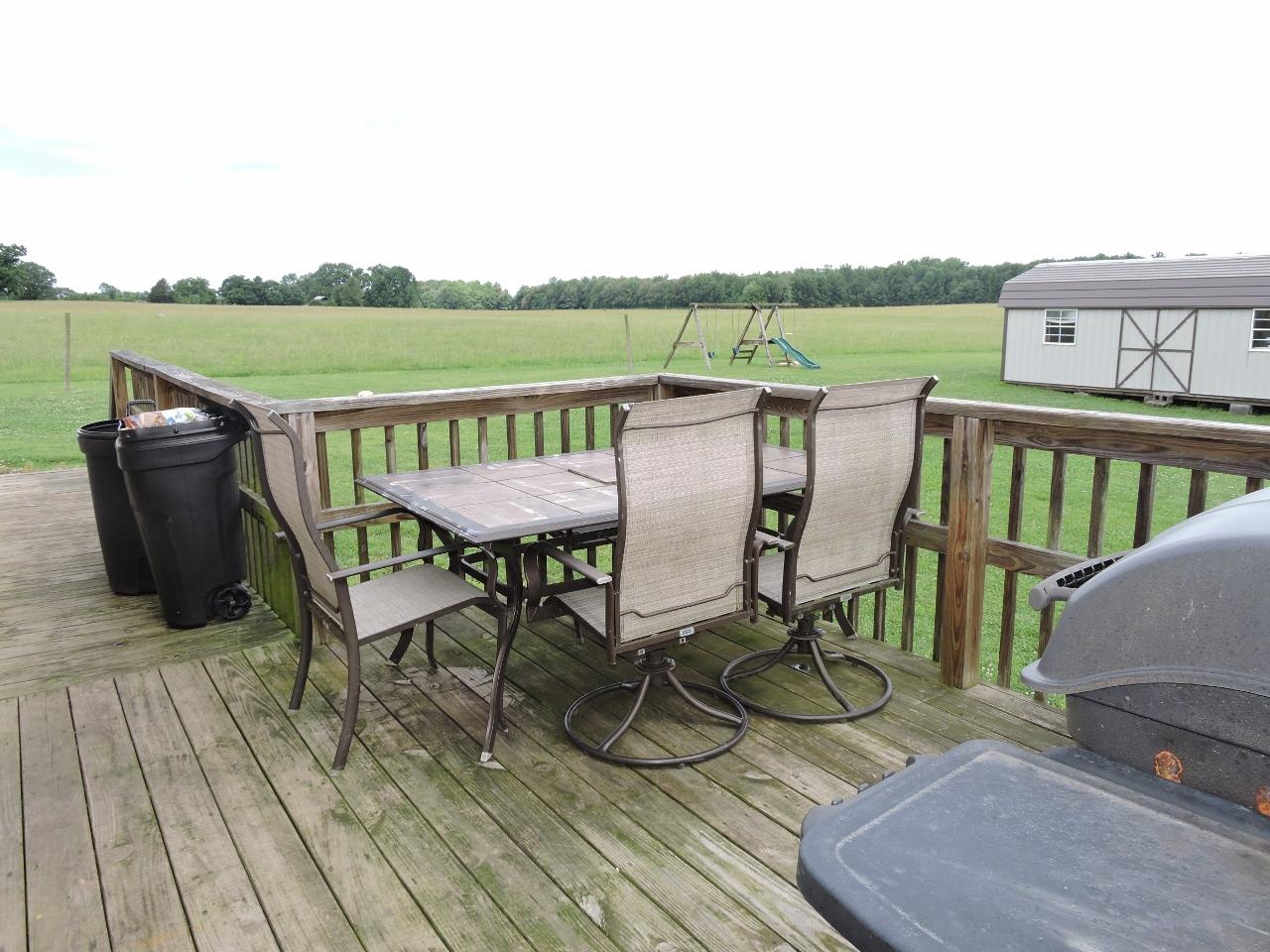 259 Bell Road Morrison, TN 37357 - Photo 24 of 27 a view of a deck with chairs and wooden floor