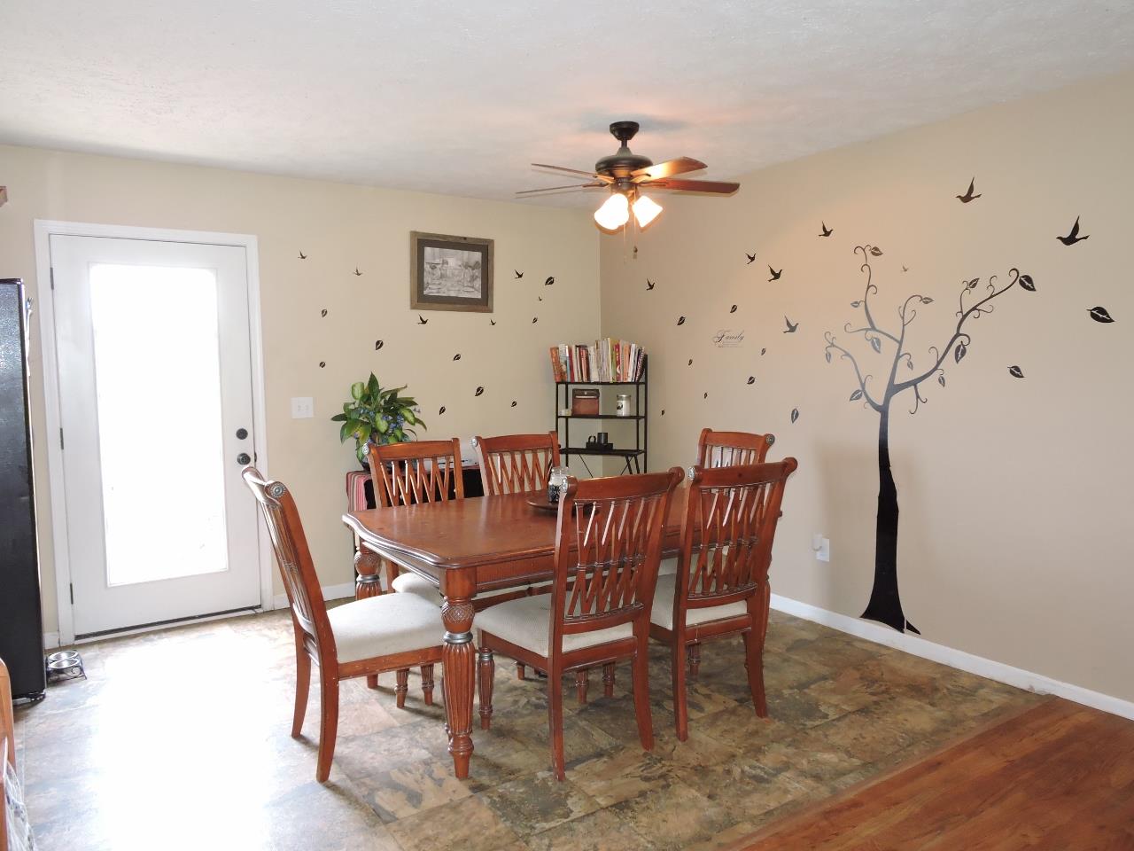 259 Bell Road Morrison, TN 37357 - Photo 6 of 27 a dining room with furniture and chandelier fan