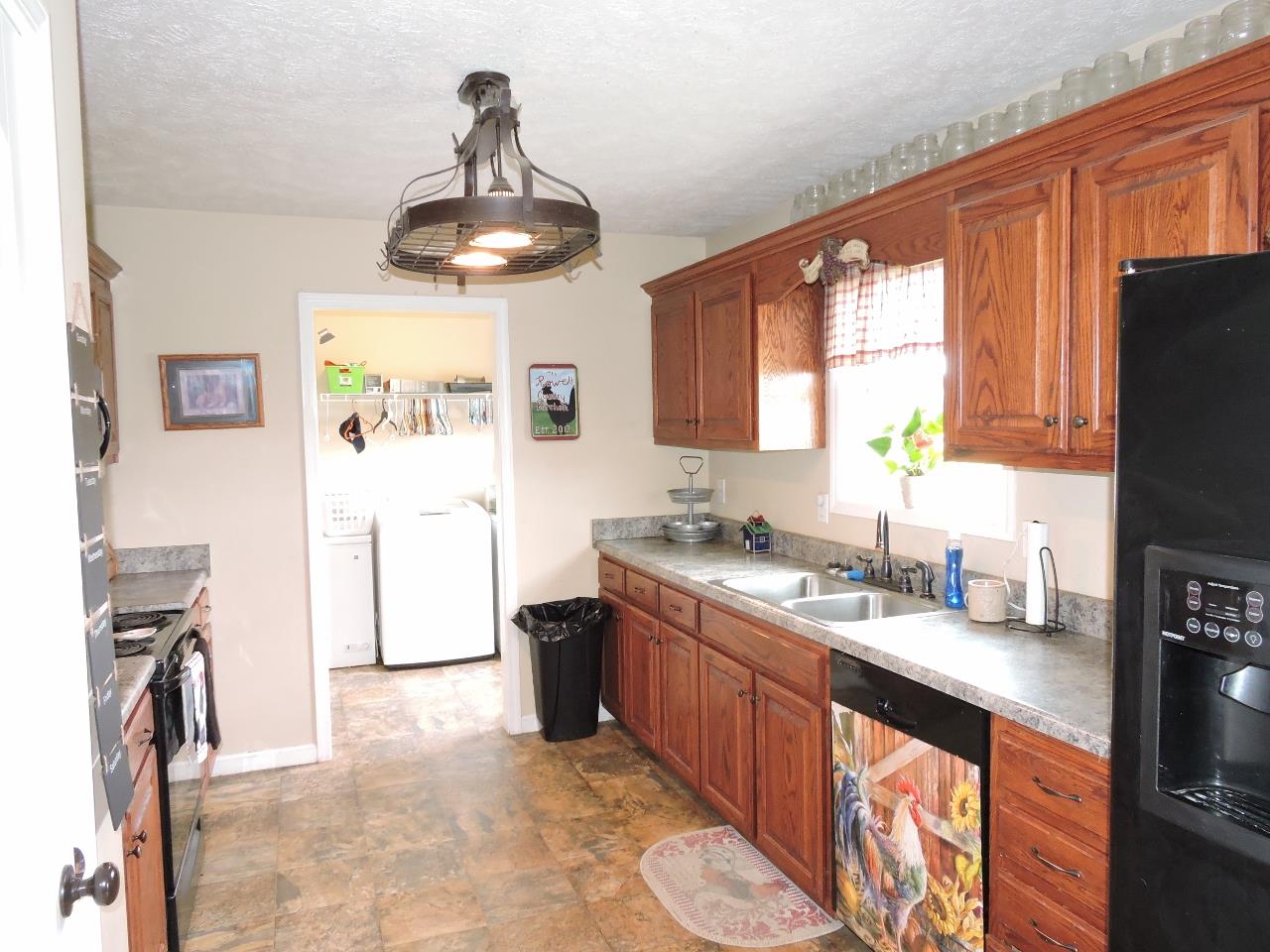 259 Bell Road Morrison, TN 37357 - Photo 10 of 27 a kitchen with stainless steel appliances granite countertop a sink stove and refrigerator