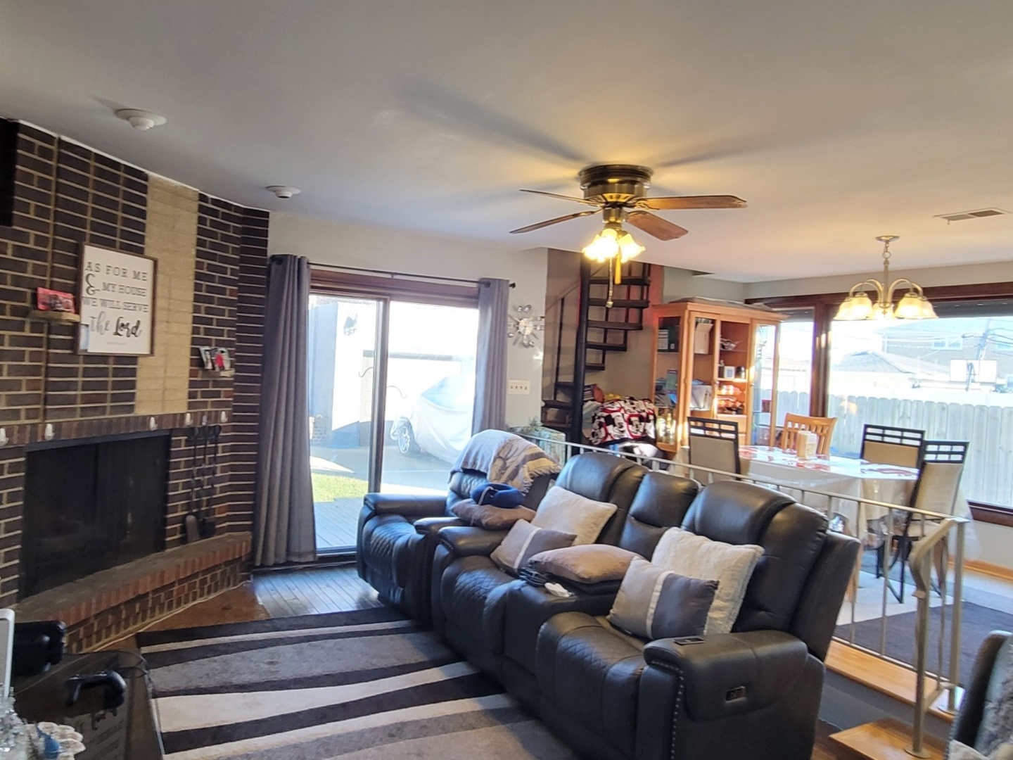 7432 West Gregory Street Chicago, IL 60656 - Photo 13 of 42 a living room with furniture a chandelier and a fireplace