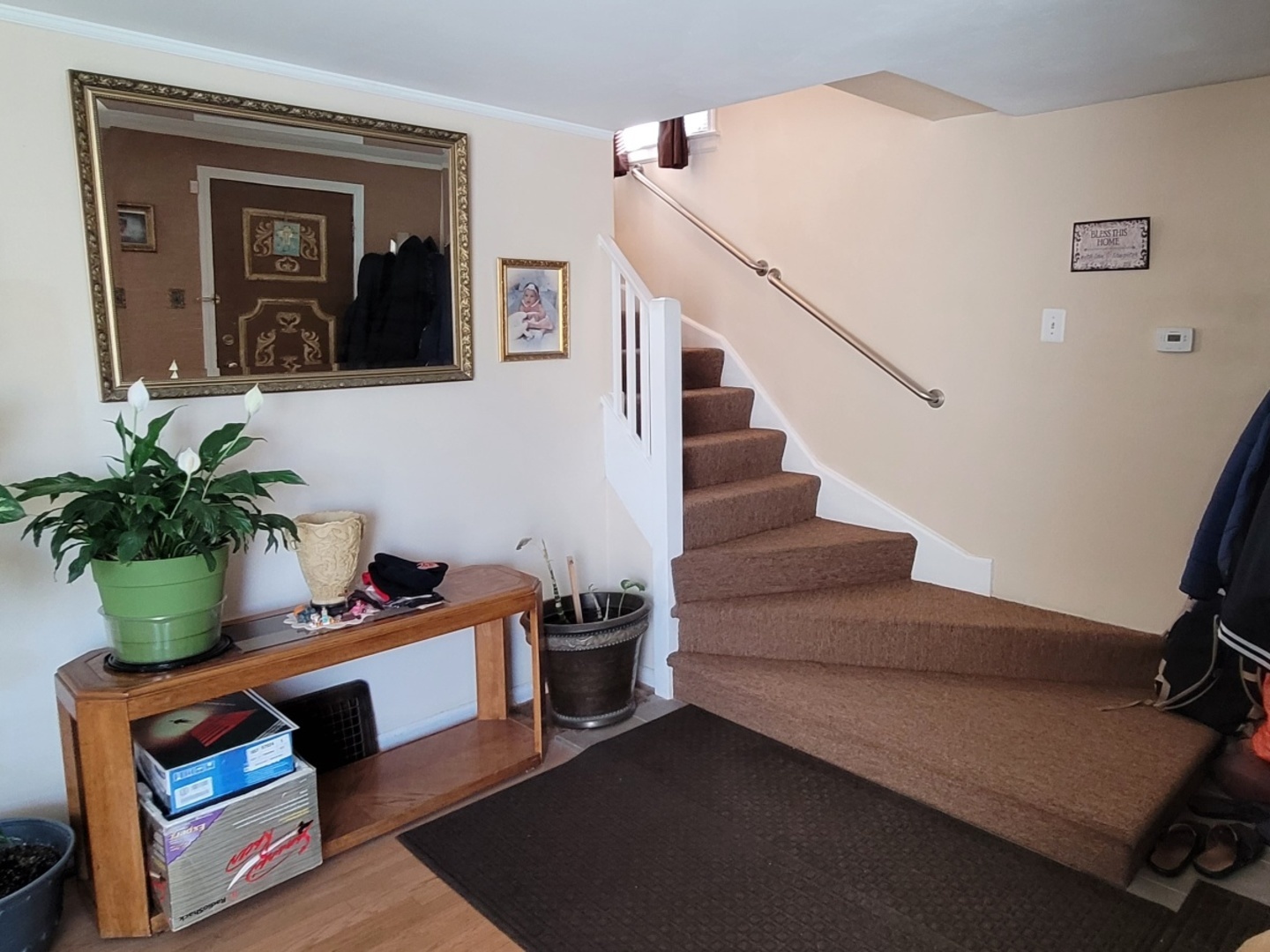 7432 West Gregory Street Chicago, IL 60656 - Photo 6 of 42 a view of an entryway with wooden floor and a potted plant