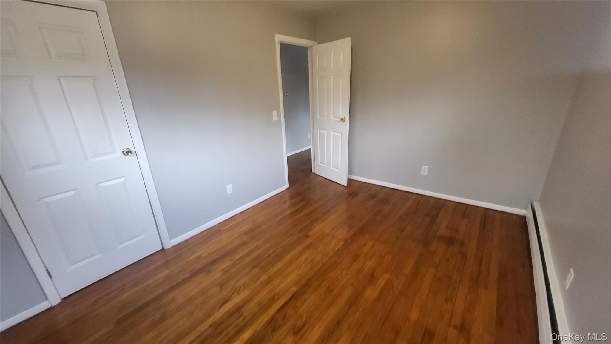 40 Haviland Road, Unit A7 Poughkeepsie, NY 12601 - Photo 11 of 12 a view of an empty room with wooden floor