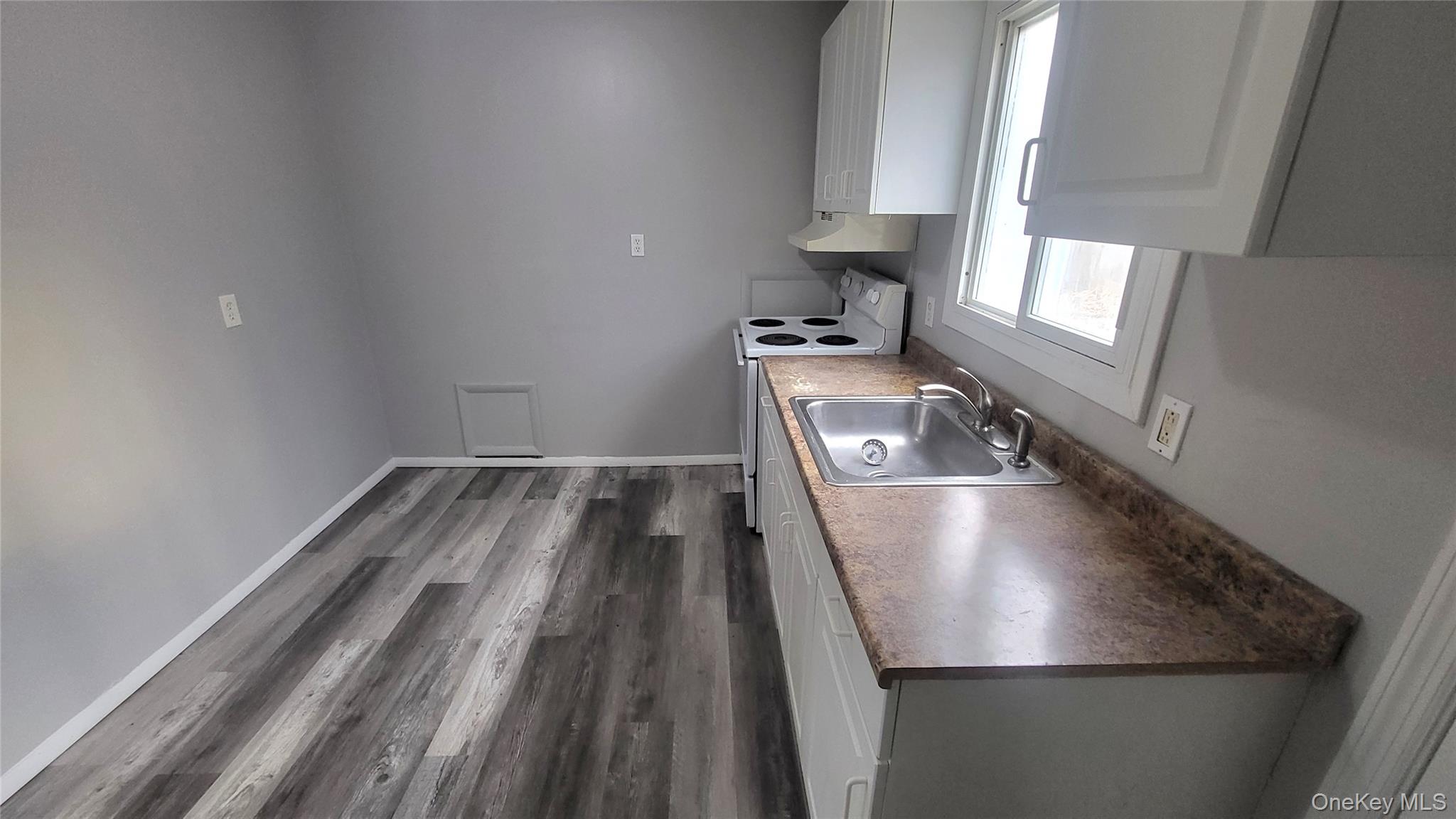 40 Haviland Road, Unit A7 Poughkeepsie, NY 12601 - Photo 2 of 12 a view closeup a room with wooden floor and staircase