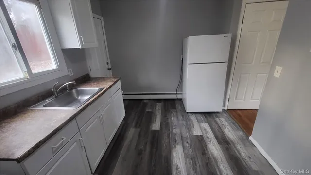 a hallway with washer and dryer