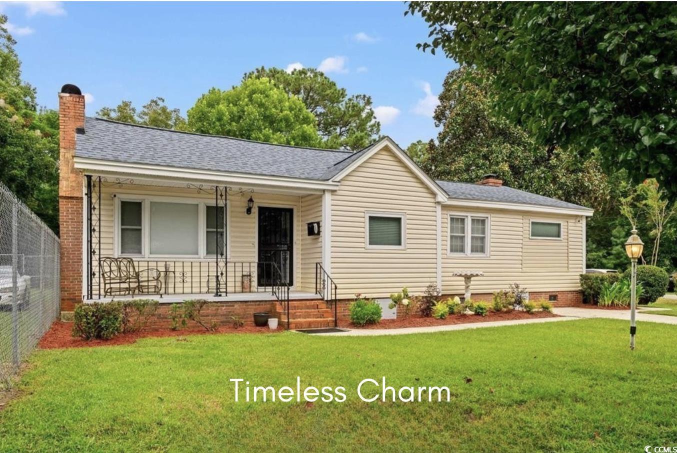 Ranch-style house with covered porch, a chimney, crawl space, and roof with shingles