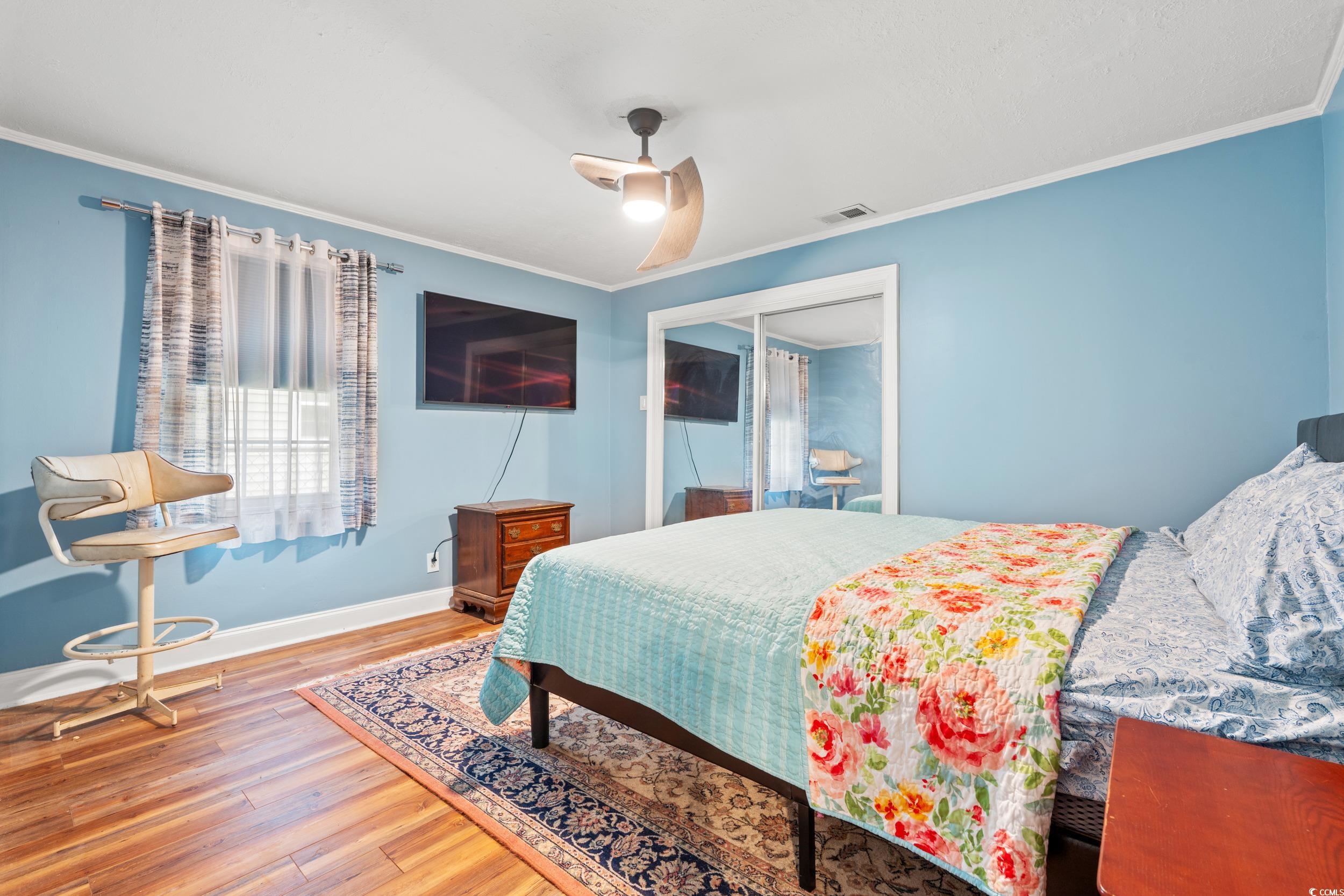 902 Palm Street Georgetown, SC 29440 - Photo 19 of 38 Bedroom featuring crown molding, wood finished floors, and a ceiling fan