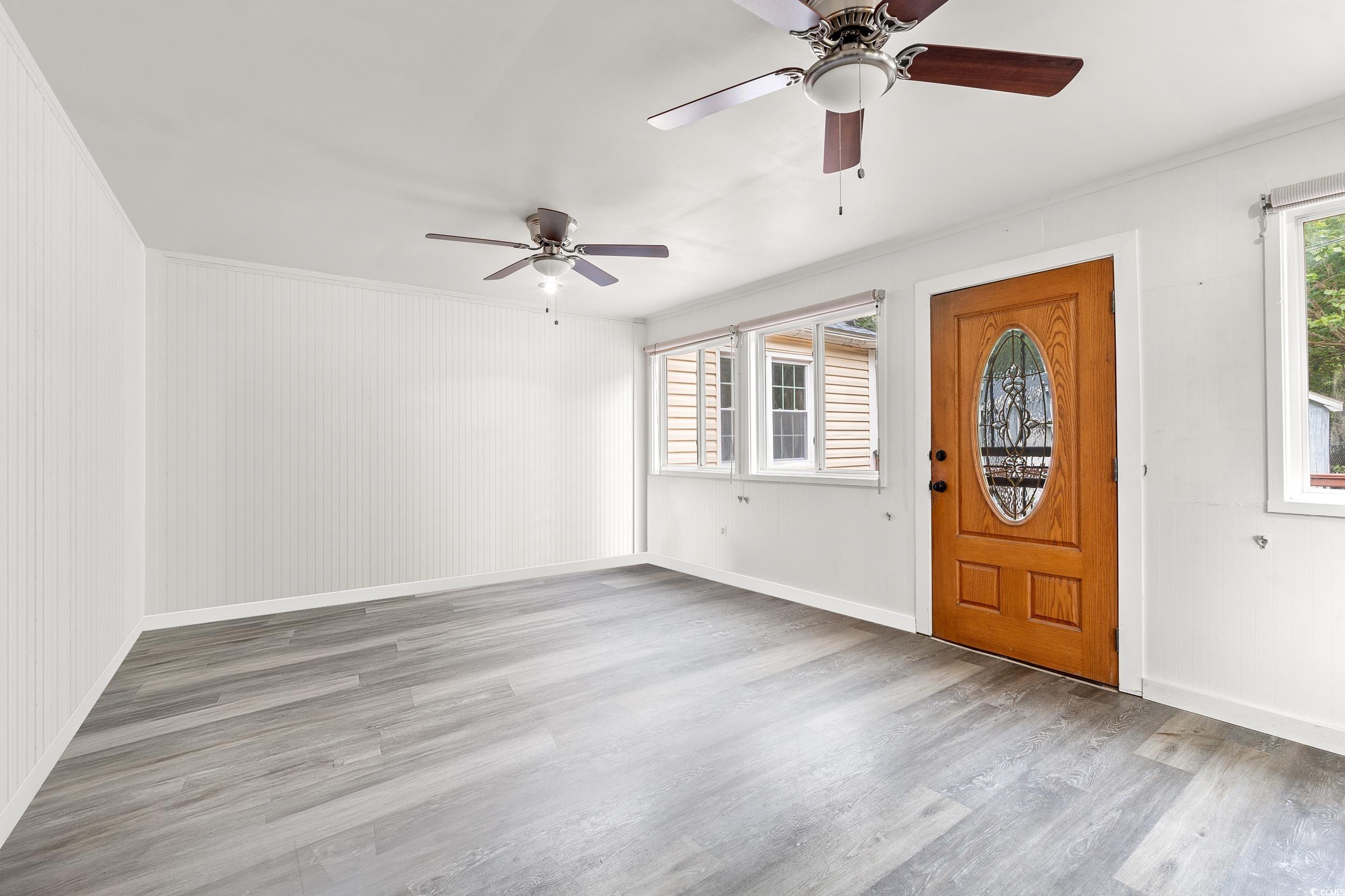 902 Palm Street Georgetown, SC 29440 - Photo 23 of 38 Entryway with light wood finished floors, ornamental molding, and ceiling fan