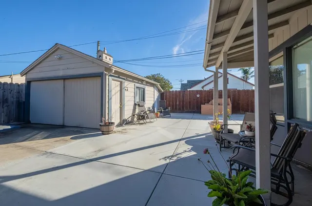 a view of a house with backyard and porch