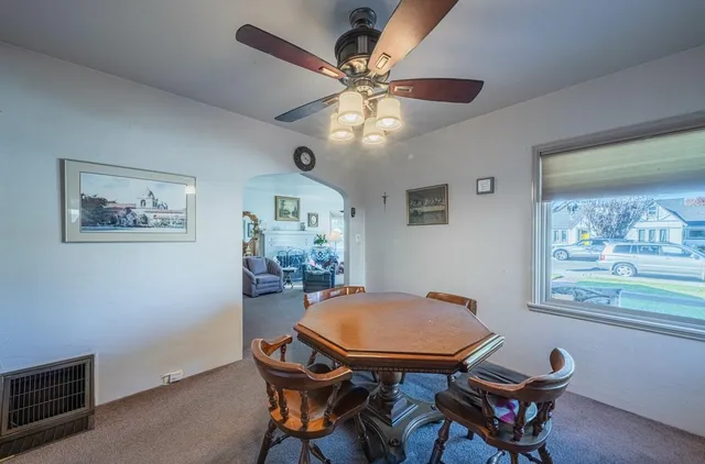a dining room with furniture and window