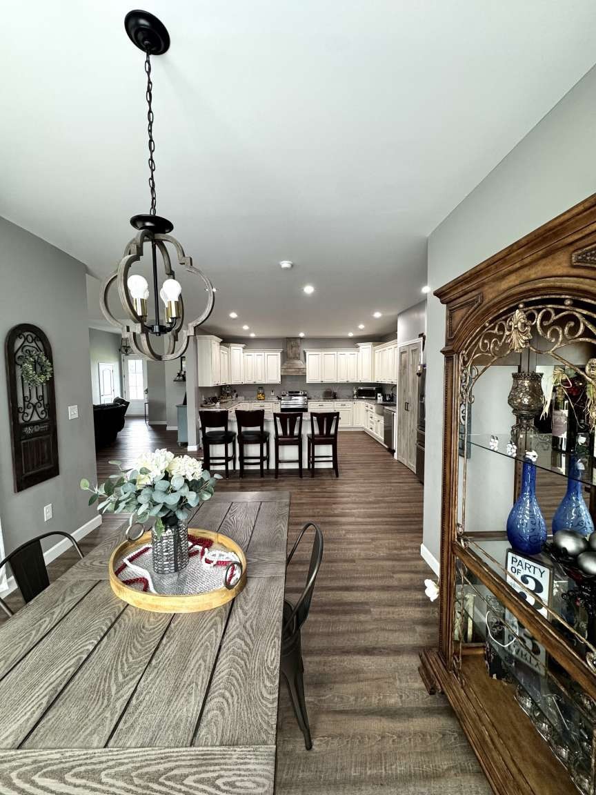5056 Spencer Hale Road Morristown, TN 37813 - Photo 14 of 69 a living room with furniture a dining table and a fireplace
