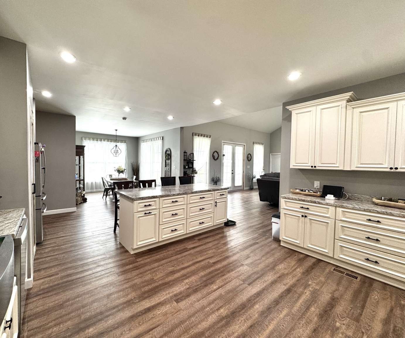 5056 Spencer Hale Road Morristown, TN 37813 - Photo 16 of 69 an open kitchen with white cabinets and stainless steel appliances