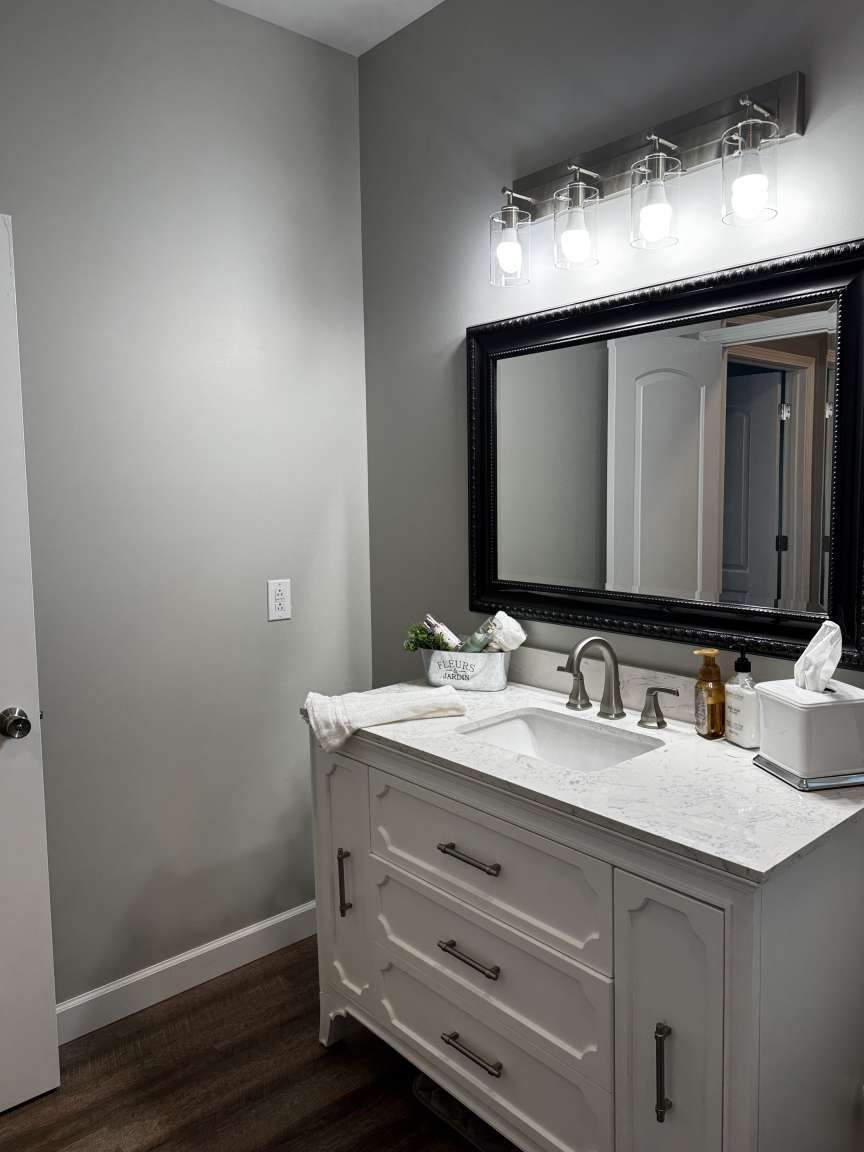 5056 Spencer Hale Road Morristown, TN 37813 - Photo 33 of 69 a bathroom with a sink and a mirror